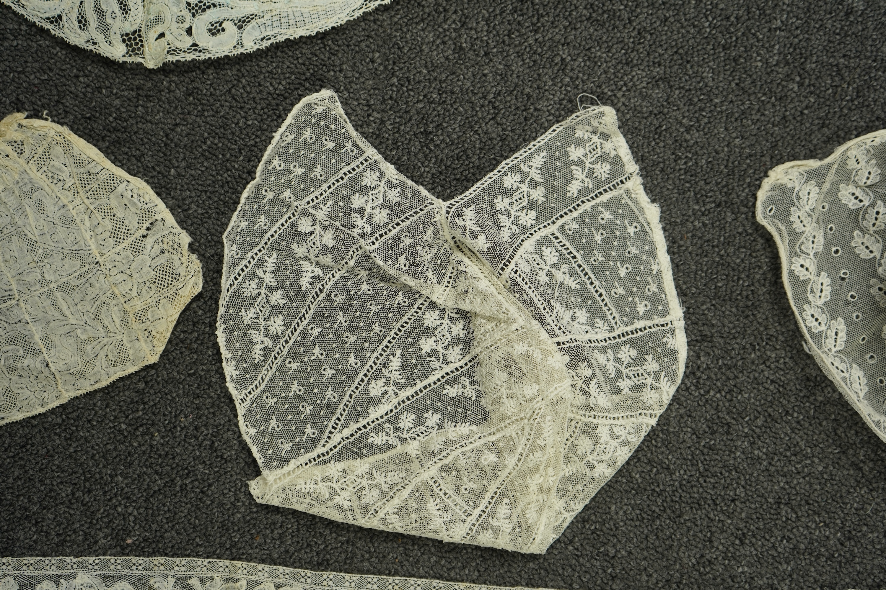 Various lengths of 18th and 19th century lace trimming and two needle run bonnets. Including a collar made from two rows of 18th century Valenciennes lace, a length Valenciennes lace, a shorter length of Pointe de Anglet